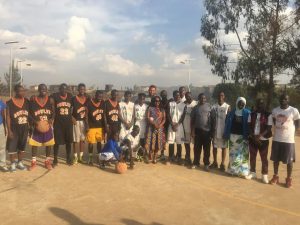 Khalil Griffith pictured with members of one of the villages in Kibera, where he visited to implement the curriculum from 'A Call to Men.'