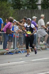 Kydani Dover running the Boston Marathon to raise money for Boston Scholars.