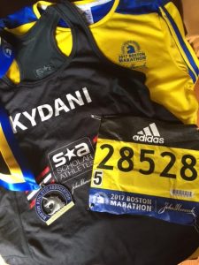 Kydani Dover's Boston Marathon apparel - shirt, jacket, number, marathon patch.