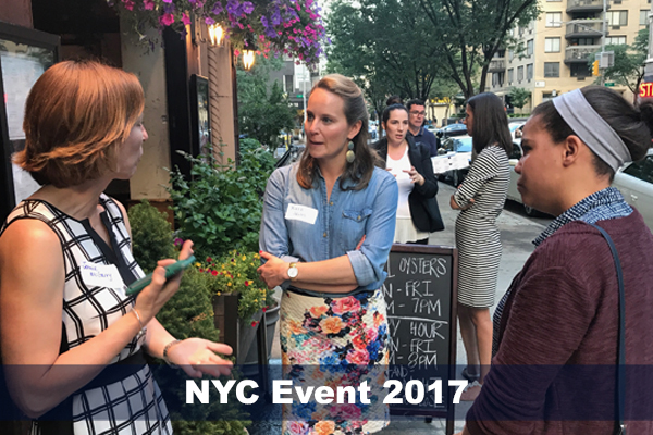 Jennie McGarry converses with two SMP alumni at NYC alumni event in 2017.