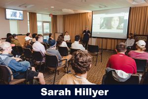 Sarah Hillyer speaking in front of students in Gentry, fall 2018